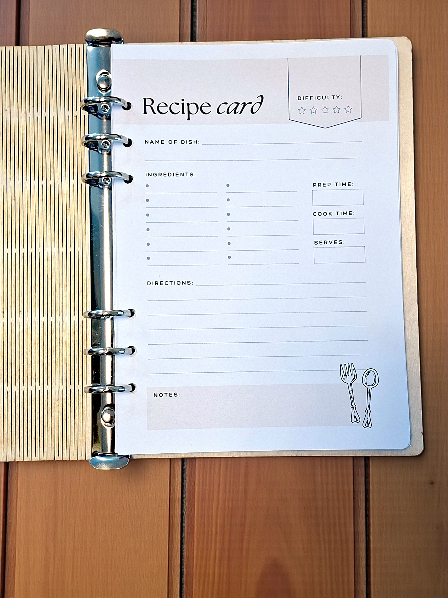 Recipe card with a binder clip on a wooden surface