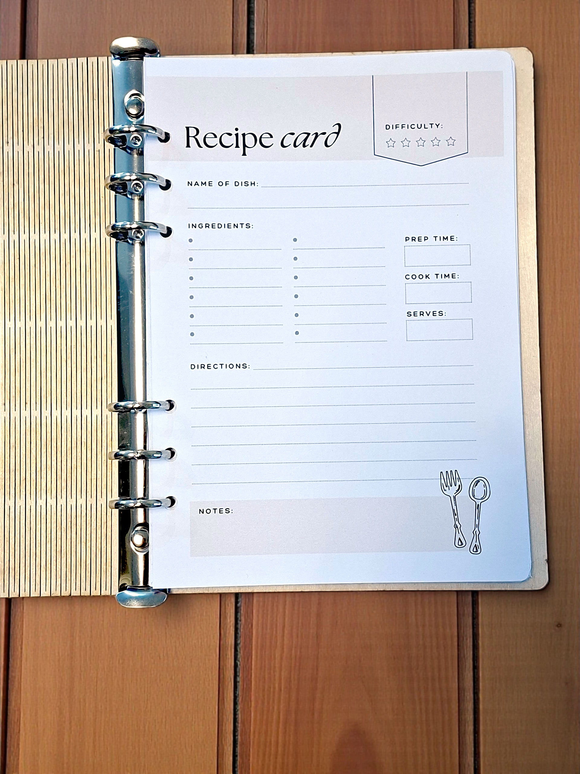 Recipe card with a binder clip on a wooden surface